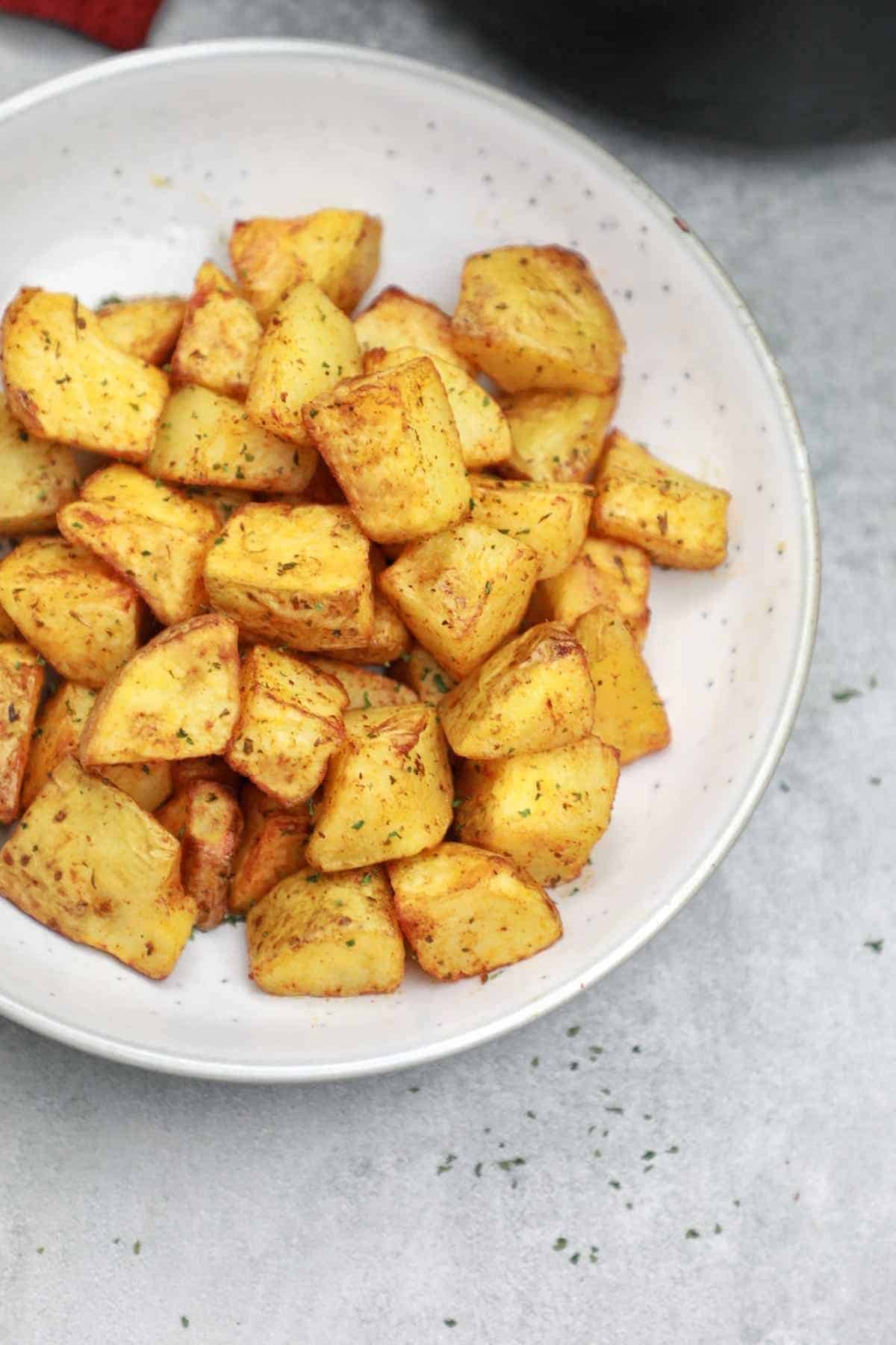 cubed potatoes served on a plate.