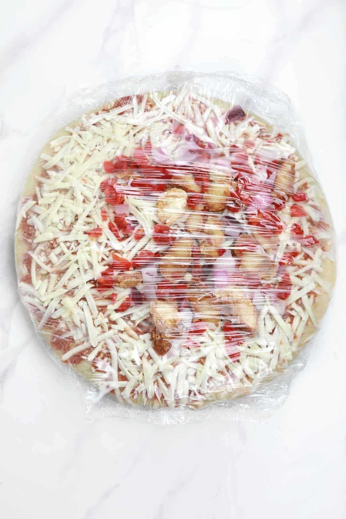 frozen pizza in packaging.