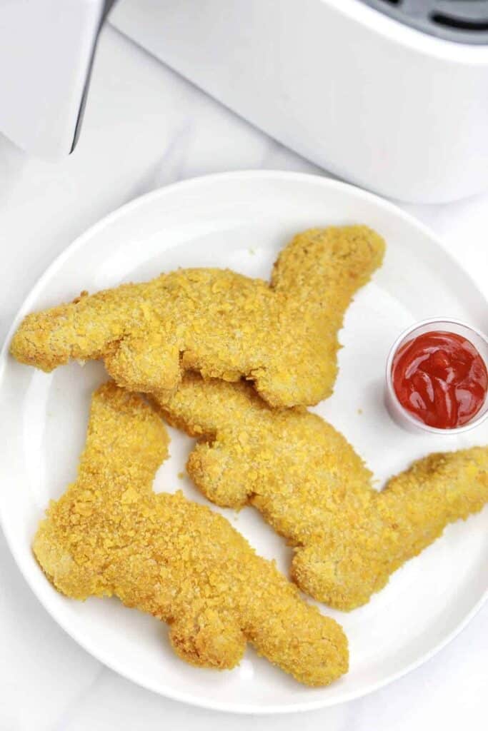 dino nuggets served on a white plate.